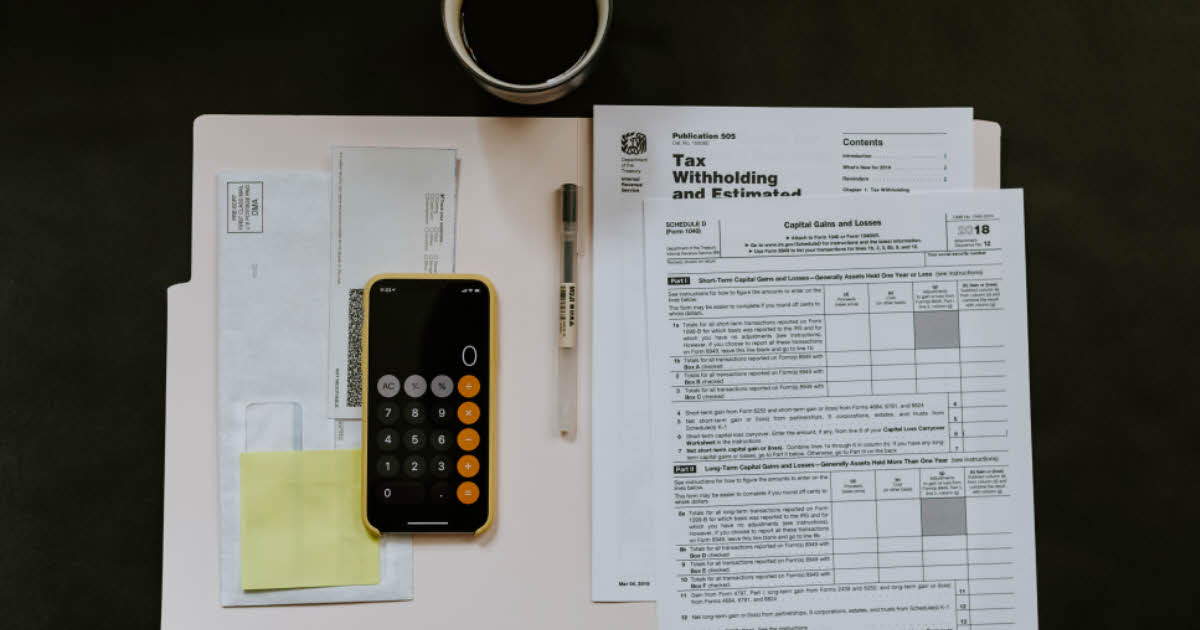 calculator on top of tax papers