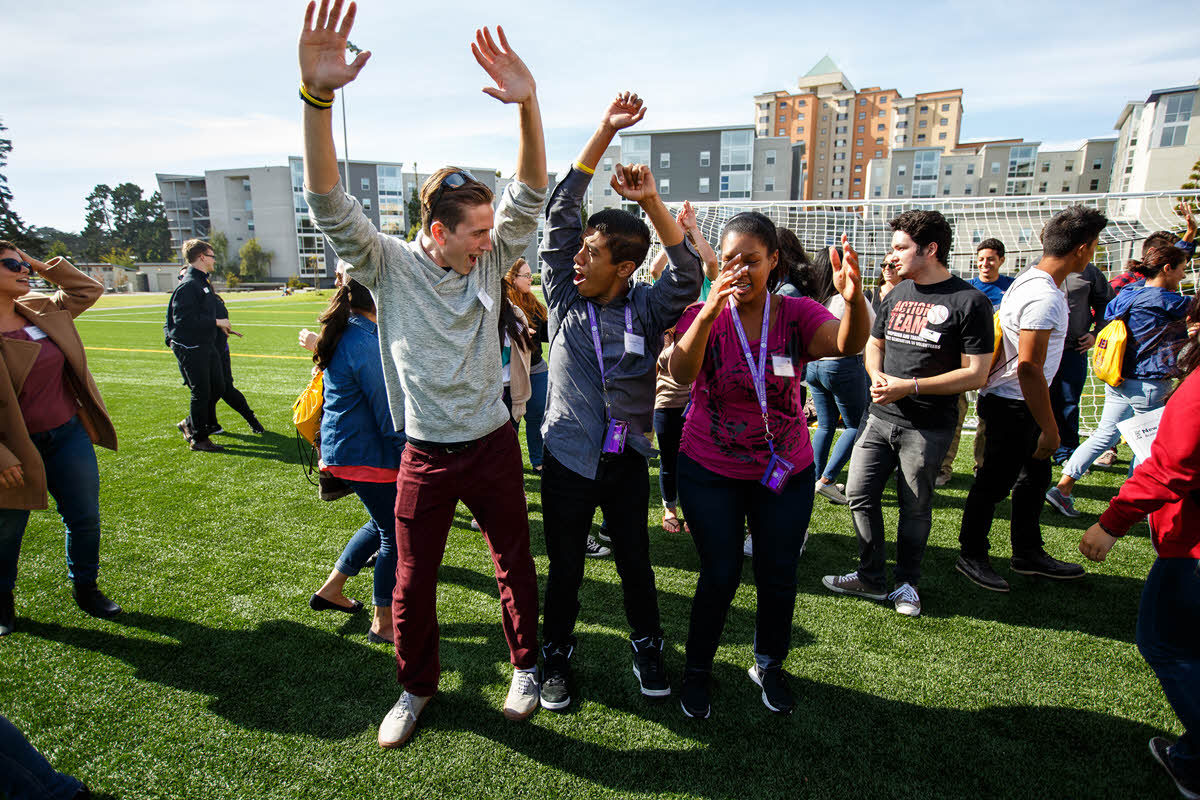 students celebrating at west campus green