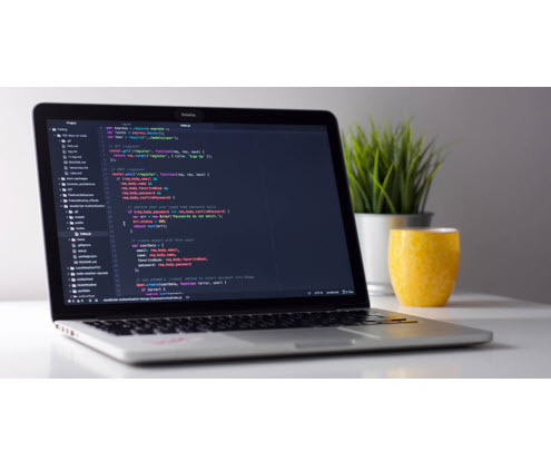 laptop with code on screen